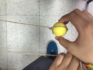 In our pendulum demonstration, golf balls were suspended from a taught piece of twine. 