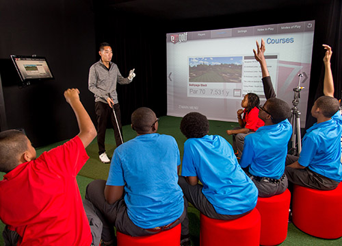 Brian Hwang with students from The Bridge Golf Foundation's after school program.