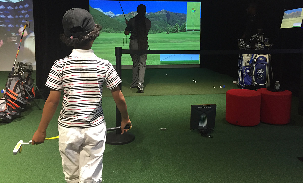 Charles, 6, watched as his father, Jon, worked on his game on Sunday morning.