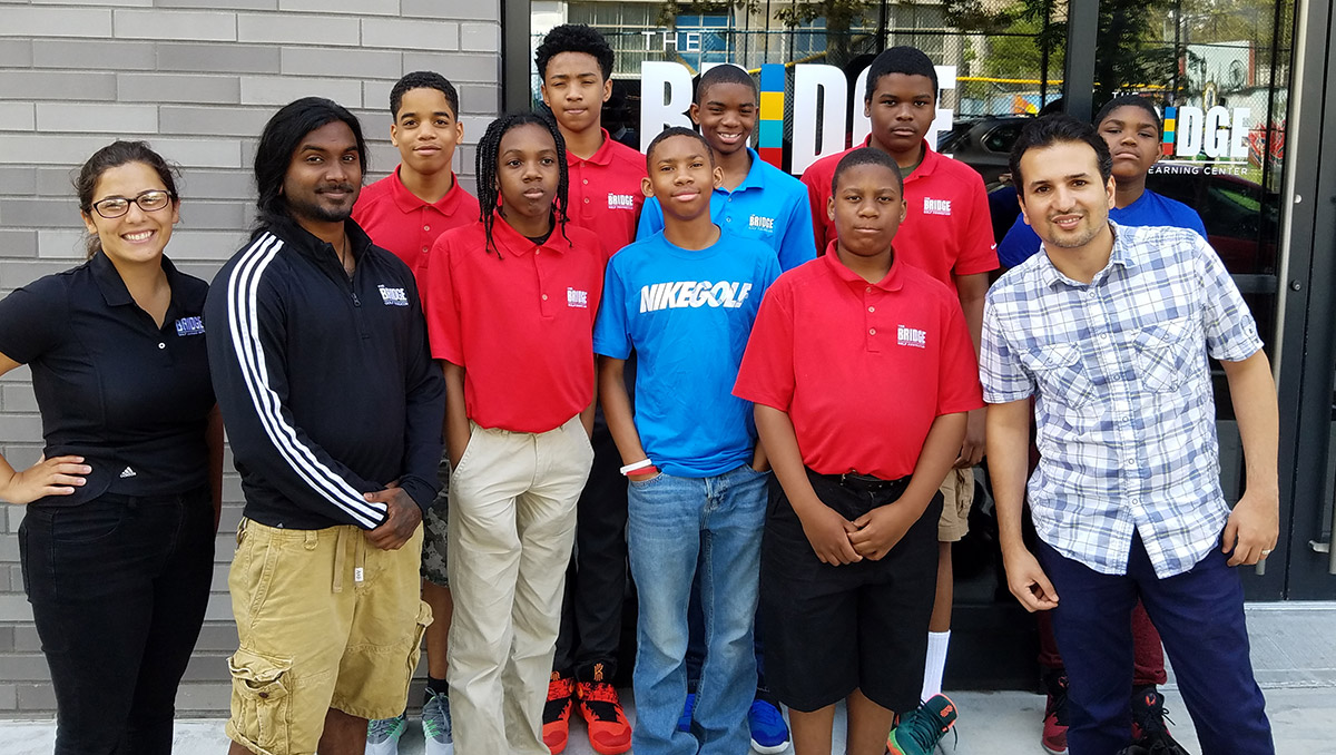 Professor Ghaemi, right, with our STEM teachers, Tiffani Kolozian and Veeshan Narinesingh, and students. 