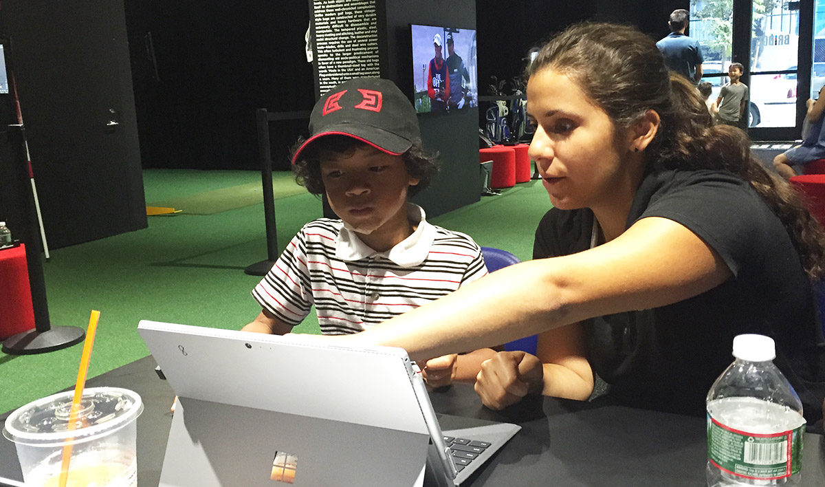 Charles worked on a coding exercise with STEM Co-Teacher Tiffani Kolozian.