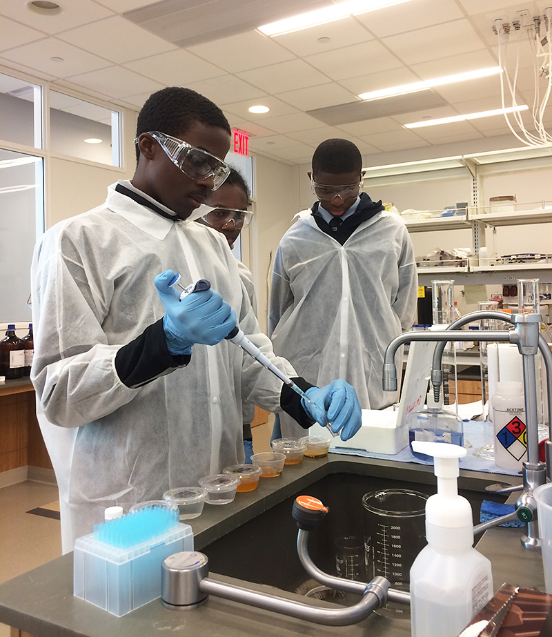 Kyle, Triniim and Tariq in the lab