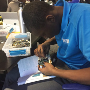 Yohance Whyte working on a circuit for sprinkler project