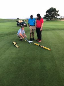 Yohance Whyte, center, and Alejandro Martinez with Course Superintendent Gregg Stanley